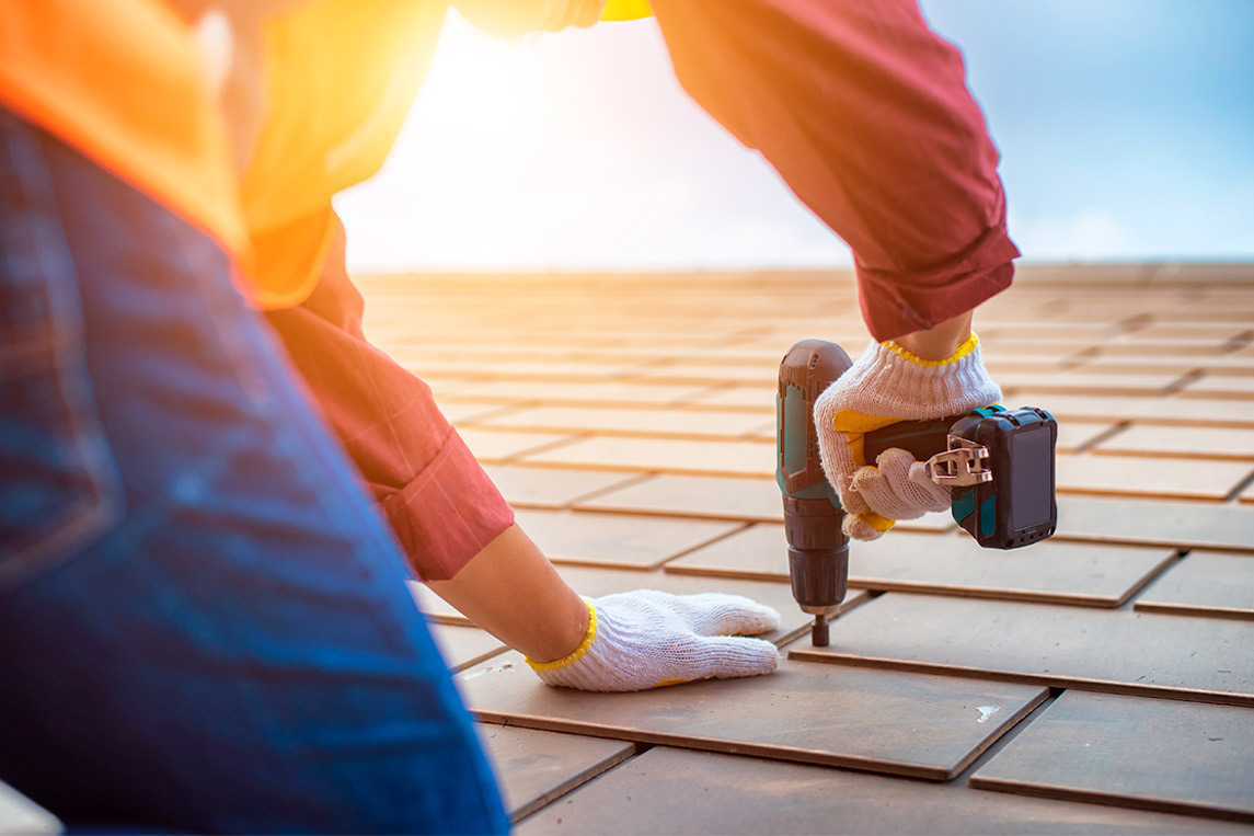 Man working at roof. Cover image for: Top Roof Maintenance Tips for Brownsville Homes